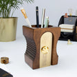 Hugely iconic and instantly recognizable, a design classic desk-tidy. This simple pencil-pot will keep your pencils, pens and desk top clutter looking sharper than the usual dull desk accessory. The "Double" features an extra space for paper-clips and smaller accessories. The "Dark" has a gold plated blade.