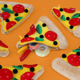 Store stationery & small items.
Plush pizza shaped case with gold zip. Store your belongings in style by tucking them into this slice of delicious pizza. Yum!

Plush Zip Pouches designed and made by SuckUK
Juicy, tasty, sweet and sour. And very cute. Stuff your stuff into something soft, and squishy. Delicious looking plush zip pouches look like foodie treats but instead of calories, they hold your everyday essentials. From cheesy slices to sickly treats, each pouch is designed to be irresistible and practi