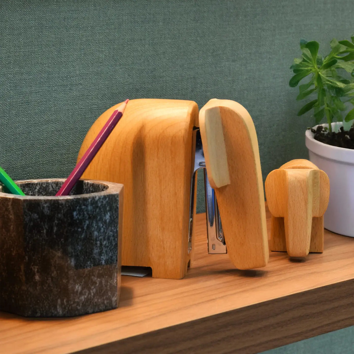 SUCK UK Wooden Elephant Stapler - Small (Baby)

Charming elephant shaped wooden staplers. Bring some character to your desk. Stands proudly upright and adds instant personality to your workspace, practical and sculptural. Made from sustainably grown beech wood. Presented in simple kraft card boxes. Accessories for people who care what their environment looks like. And perhaps a reminder to care about the environment at large?

Baby: Mini Staples No.10 (10/4mm)
Made from sustainably grown beech wood.
Stapler