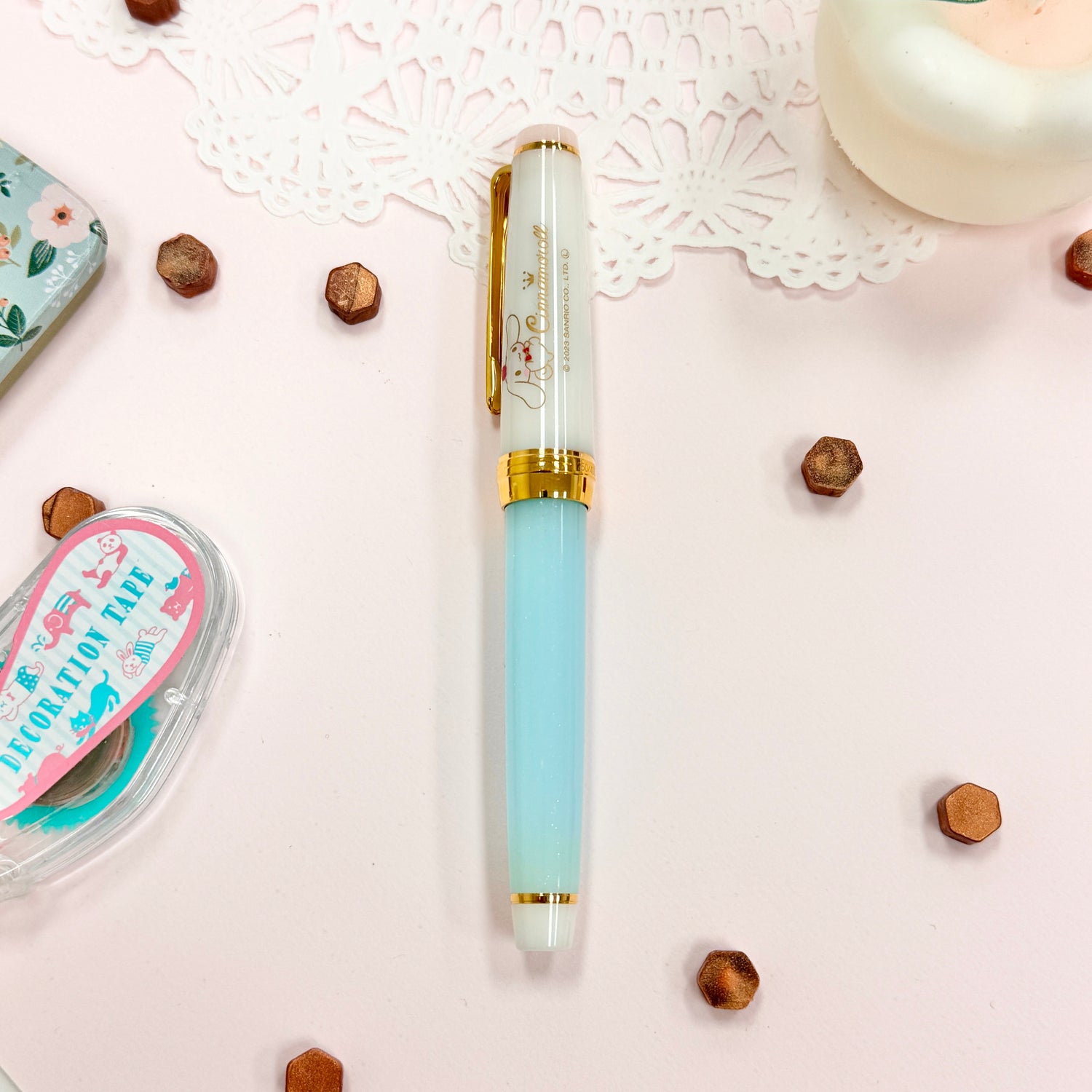 Sailor Limited Edition Professional Gear Slim Fountain Pen - Cinnamoroll

Discover a charming collaboration between Sailor Fountain Pen and Sanrio’s beloved character, Cinnamoroll! This limited-edition fountain pen captures the elegant and adorable world of Cinnamoroll, featuring luxurious gold accents on the clip and ring, along with special Cinnamoroll logo motifs on the cap, finial, and nib. The 14k gold nib is beautifully engraved with Cinnamoroll’s face, adding a delightful touch to this unique wr