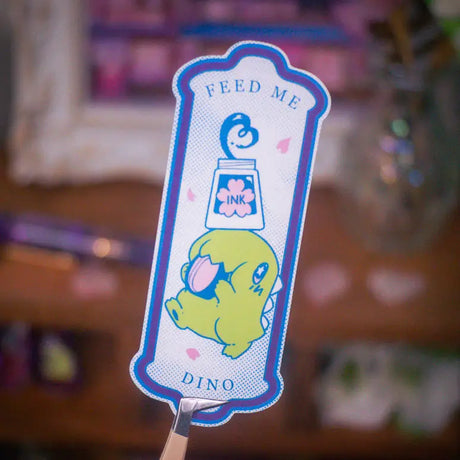 How precarious but just like him...

This is a vinyl sticker and measures about 3 inches tall and is waterproof, dishwasher safe, scratch resistant, and UV-resistant.

Dimension: 3.64in x 1.46in