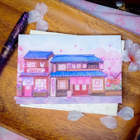 Sakuradragon - Sakura Street Shopfronts Postcard

A souvenier to send your friends from Sakura Street!

4x6" illustration postcard printed on 15pt card stock paper.
Satin matte finish.