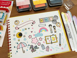 A clear stamp created in collaboration with Rainbowholic "Kawaii Journaling". Rainbowholic rainbows, Sakuralala cherry blossoms, notebooks and pencils, stamps and labels... It is packed with stamps that will be a cute accent for your notebook or journal. Please try to make a cute journal!