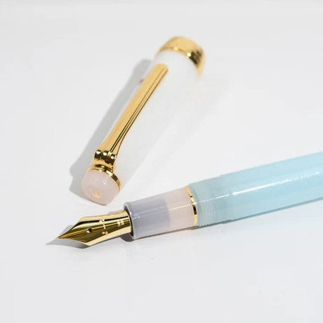 Sanrio x Sailor collaboration features the beloved character Cinnamoroll on a limited‑edition Professional Gear Slim. The 14k gold nib is engraved with Cinnamoroll’s sweet face, paired with a soft pastel colorway and an illustrated cap.