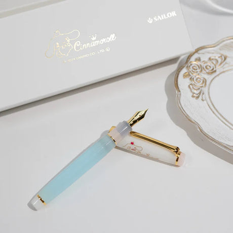 Sanrio x Sailor collaboration features the beloved character Cinnamoroll on a limited‑edition Professional Gear Slim. The 14k gold nib is engraved with Cinnamoroll’s sweet face, paired with a soft pastel colorway and an illustrated cap.