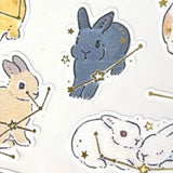Schinako Moriyama Rabbits and Starry Sky Sticker Sheet

A sticker sheet with golden touches featuring rabbits surrounded in stars and constellations is here to add both adorable and elegant touches to your journal pages ♪