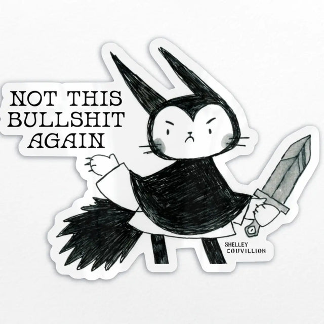 This annoyed lil cutie is from my zine, No Dragons No Kings, (Don't worry, I actually love dragons, we're just using them as shorthand for oligarchs) That zine is available in the zine section if you're interested in that as well. 

✨ Details:
• Size: approx. 2.4” tall
• glossy finish
• Waterproof & scratch-resistant
• Great for goth girls, witchy souls, and animal lovers with attitude