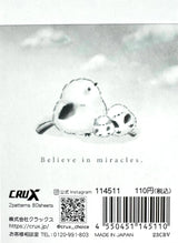 Product packaging with a bird illustration and text 'Believe in miracles.' by CRUX.