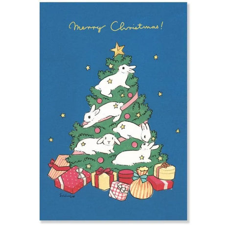 This postcard is packed with the unique world of Shinako Moriyama, where the rabbits have become decorations on the Christmas tree. It features a beautiful gold leaf message. These are warm postcards brighten up your Christmas atmosphere.