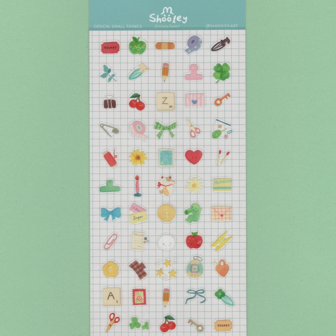 Shooley Small Things Sticker Sheet

Clear vinyl sticker sheet. Each sheet comes with a backing card. Sticker material is water resistant.