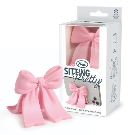 Sitting Pretty Bow Phone Stand

Why settle for a boring stand when you can have your phone Sitting Pretty? Fred’s coquette-inspired phone stand features a cute bow design that’s pretty, pink, and perfectly poised for scrolling, streaming, and staying hands-free. Made from soft-touch rubber, it’s equally fashionable as it is functional.

Measures 2.6" x 2.4" x 2.4"&nbsp;
Design by Winsor Pop, Fred Studio.