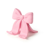 Sitting Pretty Bow Phone Stand

Why settle for a boring stand when you can have your phone Sitting Pretty? Fred’s coquette-inspired phone stand features a cute bow design that’s pretty, pink, and perfectly poised for scrolling, streaming, and staying hands-free. Made from soft-touch rubber, it’s equally fashionable as it is functional.

Measures 2.6" x 2.4" x 2.4"&nbsp;
Design by Winsor Pop, Fred Studio.