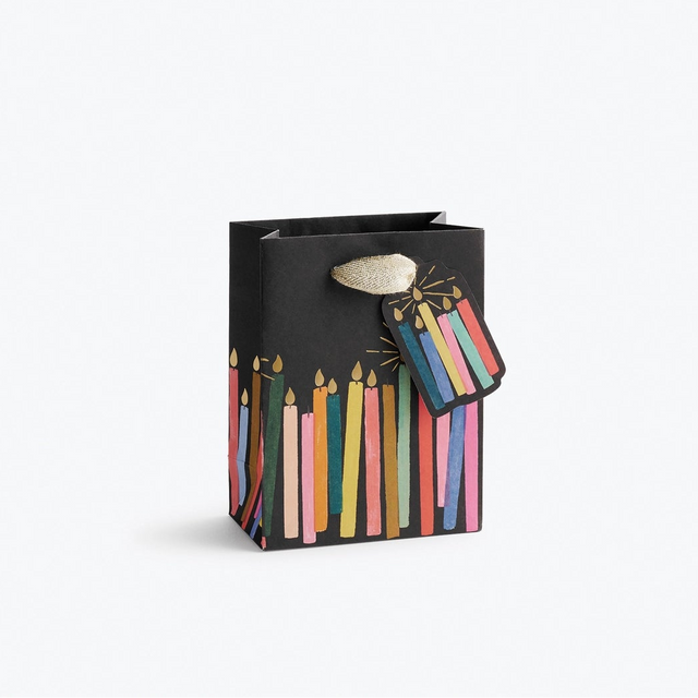 Giving gets even more special with our gift bags, which feature charming extras like gold foil accents, cotton ribbon handles, and a coordinating “To” and “From” tag.

Small: 6 x 4.5 x 0.3 in
Coated paper with cotton ribbon handles
Printed in full color and UV gold glitter
Gold lurex ribbon handles
