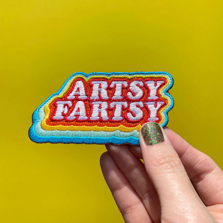 Artsy Farsty, all day every day

Embroidered patch
Iron on backing
3.5" x 1.8"
Packaged in a cellophane hanging bag
Recycled kraft paper backing card
Application instructions are included on the back side of packaging
Designed in Knoxville, TN, produced in China