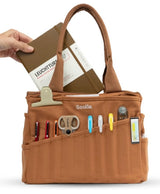 Your art is bold. Your bag should be too. The world's most loved art supply bag, pottery tool bag &amp; knitting project bag – backed by over 10,000 global artists!

✌️ 15 stunning colors ✌️

🌈 Over 30 Pockets Of Varying Sizes

🌈 Slanted Skinny Pockets : For your most-loved tools that beg for your attention (carving tools, knitting needles, crochet hooks

🌈&nbsp;Large Interior Storage + 2 interior pockets: Perfect for carrying glazes, knitting yarn, crochet supplies, and craft supplies

🌈 Phone &amp; Wa