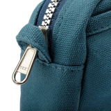 Front layout: 8 slanted pockets + 3 directly behind
Interior: Main compartment fits an A5 notebook; two open compartments on each wall
Back panel: 3 wide exterior pockets + one full-length slip pocket&nbsp;
Quick-drying duck canvas — sturdy, breathable, and machine-washable
Convertible design — hooks for your own strap or a Soolla strap (coming soon)&nbsp;
Structured silhouette — holds its shape even when lightly packed
Full-width YKK zipper — smooth and durable
Compact profile — fits inside larger bags or 