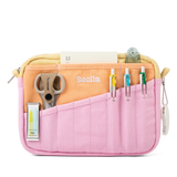 Front layout: 8 slanted pockets + 3 directly behind
Interior: Main compartment fits an A5 notebook; two open compartments on each wall
Back panel: 3 wide exterior pockets + one full-length slip pocket&nbsp;
Quick-drying duck canvas — sturdy, breathable, and machine-washable
Convertible design — hooks for your own strap or a Soolla strap (coming soon)&nbsp;
Structured silhouette — holds its shape even when lightly packed
Full-width YKK zipper — smooth and durable
Compact profile — fits inside larger bags or 