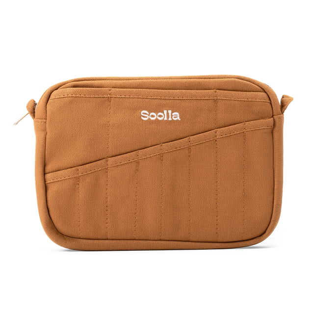 Features &amp; Specs

Front layout: 8 slanted pockets + 3 directly behind
Interior: Main compartment fits an A5 notebook; two open compartments on each wall
Back panel: 3 wide exterior pockets + one full-length slip pocket&nbsp;
Quick-drying duck canvas — sturdy, breathable, and machine-washable
Convertible design — hooks for your own strap or a Soolla strap (coming soon)&nbsp;
Structured silhouette — holds its shape even when lightly packed
Full-width YKK zipper — smooth and durable
Compact profile — fits 
