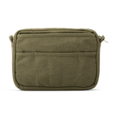 Features &amp; Specs

Front layout: 8 slanted pockets + 3 directly behind
Interior: Main compartment fits an A5 notebook; two open compartments on each wall
Back panel: 3 wide exterior pockets + one full-length slip pocket&nbsp;
Quick-drying duck canvas — sturdy, breathable, and machine-washable
Convertible design — hooks for your own strap or a Soolla strap (coming soon)&nbsp;
Structured silhouette — holds its shape even when lightly packed
Full-width YKK zipper — smooth and durable
Compact profile — fits 