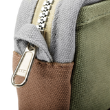 Features &amp; Specs

Front layout: 8 slanted pockets + 3 directly behind
Interior: Main compartment fits an A5 notebook; two open compartments on each wall
Back panel: 3 wide exterior pockets + one full-length slip pocket&nbsp;
Quick-drying duck canvas — sturdy, breathable, and machine-washable
Convertible design — hooks for your own strap or a Soolla strap (coming soon)&nbsp;
Structured silhouette — holds its shape even when lightly packed
Full-width YKK zipper — smooth and durable
Compact profile — fits 