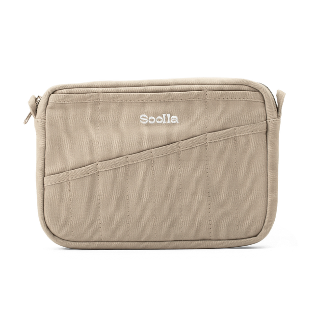 Features &amp; Specs

Front layout: 8 slanted pockets + 3 directly behind
Interior: Main compartment fits an A5 notebook; two open compartments on each wall
Back panel: 3 wide exterior pockets + one full-length slip pocket&nbsp;
Quick-drying duck canvas — sturdy, breathable, and machine-washable
Convertible design — hooks for your own strap or a Soolla strap (coming soon)&nbsp;
Structured silhouette — holds its shape even when lightly packed
Full-width YKK zipper — smooth and durable
Compact profile — fits 