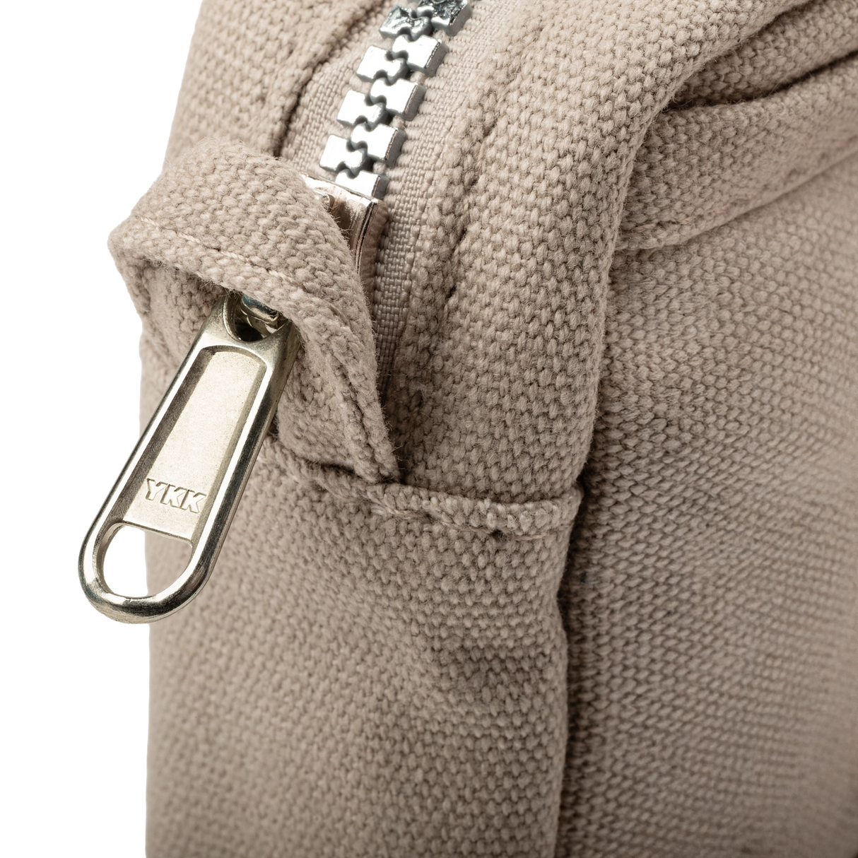 Features &amp; Specs

Front layout: 8 slanted pockets + 3 directly behind
Interior: Main compartment fits an A5 notebook; two open compartments on each wall
Back panel: 3 wide exterior pockets + one full-length slip pocket&nbsp;
Quick-drying duck canvas — sturdy, breathable, and machine-washable
Convertible design — hooks for your own strap or a Soolla strap (coming soon)&nbsp;
Structured silhouette — holds its shape even when lightly packed
Full-width YKK zipper — smooth and durable
Compact profile — fits 