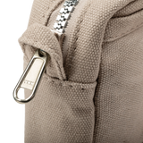 Features &amp; Specs

Front layout: 8 slanted pockets + 3 directly behind
Interior: Main compartment fits an A5 notebook; two open compartments on each wall
Back panel: 3 wide exterior pockets + one full-length slip pocket&nbsp;
Quick-drying duck canvas — sturdy, breathable, and machine-washable
Convertible design — hooks for your own strap or a Soolla strap (coming soon)&nbsp;
Structured silhouette — holds its shape even when lightly packed
Full-width YKK zipper — smooth and durable
Compact profile — fits 