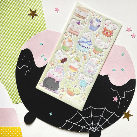 This heart-eared mouse loves spooky sweets so much they’re becoming them! We totally get it -- we could eat these pastel goodies all day long too. 🧁