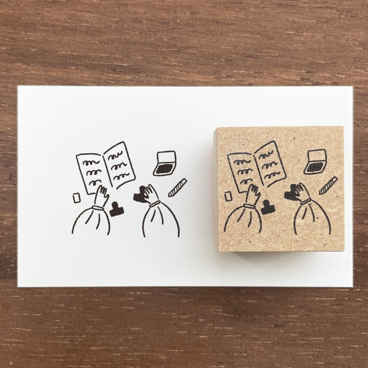 
Bring a touch of charm to your journaling with this adorable Marl‑chan wooden stamp from Stamp Marche. Featuring the brand’s signature sign girl, this illustration stamp adds personality and warmth to planners, letters, scrapbooks, and creative projects.

Each stamp is crafted with a solid wooden mount and high‑quality rubber, giving you crisp, clean impressions every time. Whether you’re decorating daily spreads or adding a cute accent to handmade cards, Marl‑chan brings a delightful, whimsical feel to yo