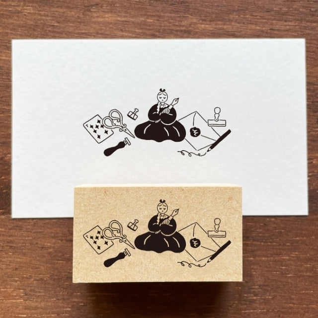 Stamp Marche Maru-Chan Stationery Land Wooden Stamp White card with black illustrations of a person playing a stringed instrument on a wooden surface.