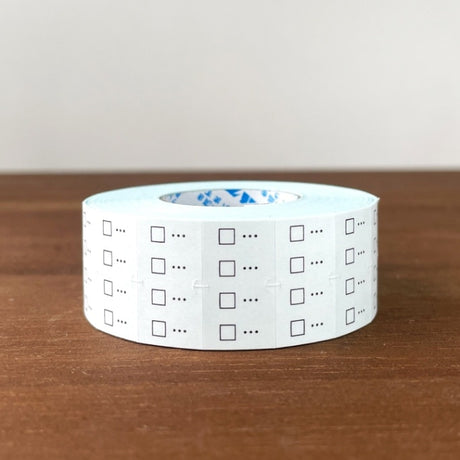 Stamp Marche Planner Label Sticker Roll - Checkbox Roll of checkered tape with checkboxes on a wooden surface