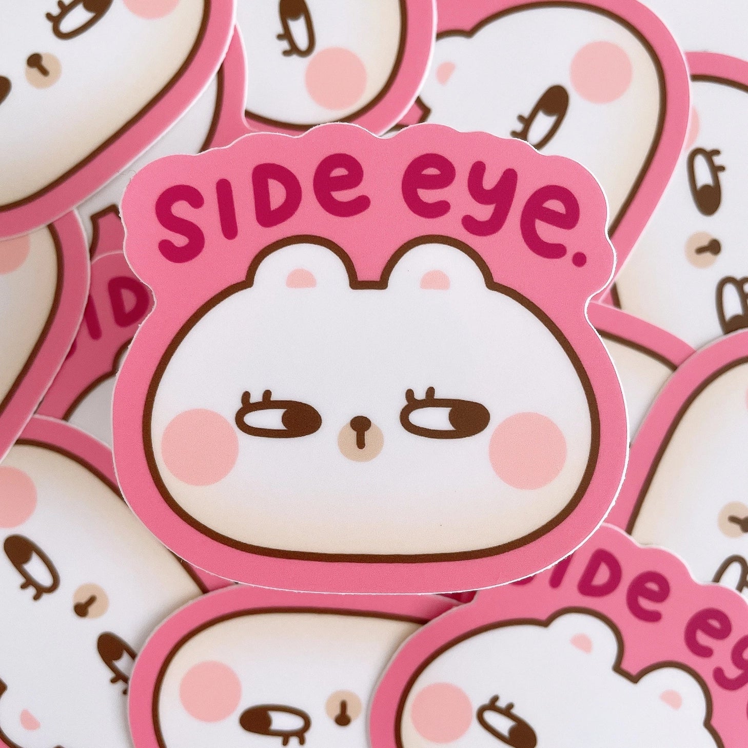 Rice the Bear gives you side eye... This heavy duty waterproof vinyl sticker is perfect for decorating any laptop, water bottle, iPad case, notebook cover, etc!

Details:

Heavy duty vinyl
Waterproof
Dimensions of sticker: approx 2.6 in x 2.4 in&nbsp;