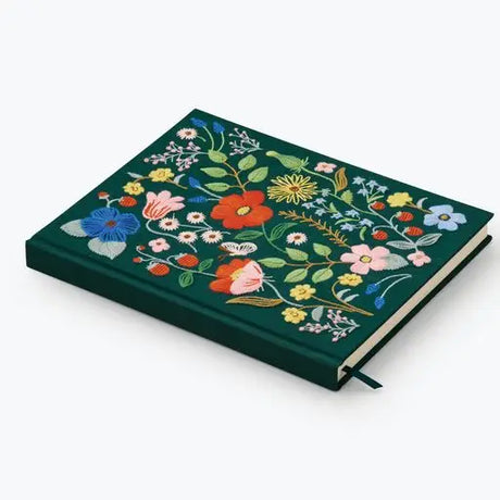 Our embroidered sketchbook is a large, hardcover journal with 108 unlined pages of thick paper perfect for sketching, drawing, and journaling. The cover is wrapped in dark green book cloth and embroidered with our Strawberry Fields florals, and an attached grosgrain ribbon bookmark will save your place.