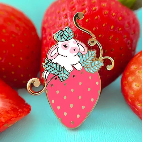 This little bunny is having a blast playing around in a strawberry patch. The perfect strawberry was chosen out of the bunch.

✦ Hard enamel
✦ Shiny gold metal
✦ 1.50 inches
✦ 2 Posts for extra security
✦ Rubber backings
✦ Back stamped for authenticity

Comes packaged on a backing card.