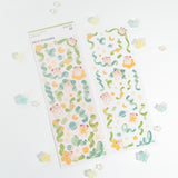 The Cocoroll Sweets deco sticker sheet features Cocoroll playing among the stars. Available in blue and green versions, these cute deco stickers are the perfect addition to any polaroids/toploaders, journals, and more. The sparkly holo overlay adds an extra touch of shine and magic.

Dimensions: 2.7” x 8" (6.8cm x 20.5cm)
Quantity: 1 sheet