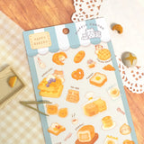The Happy Bakery sticker collection features Muffinmaru and friends alongside delicious baked goods. This sticker sheet is filled with freshly baked bread, perfect for adding a sprinkle of cuteness to your planner or journal.

Dimensions: 3.5" x 7.8" (9cm x 20cm)
Material: PET
Quantity: 1 sheet