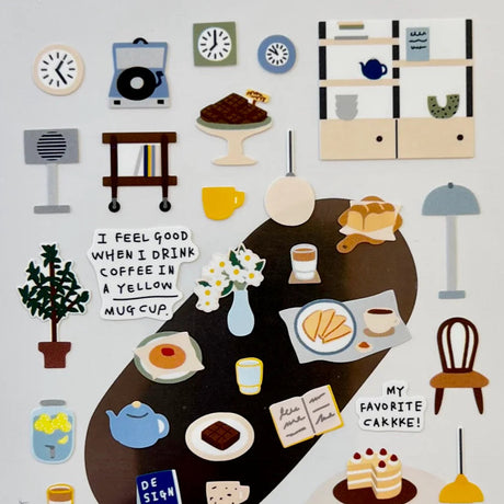 Bring the calm, cozy charm of a quiet café into your journal or planner with the Cafe Blue sticker sheet from Suatelier. Featuring soft blue tones and whimsical illustrations, this sheet captures the peaceful mood of slow mornings, warm drinks, and gentle everyday moments. Known for their soft colors and playful aesthetic, Suatelier stickers add an instant dose of warmth and whimsy wherever you place them.

Package measures approx. 8" x 3.5"
Includes 1 sticker sheet