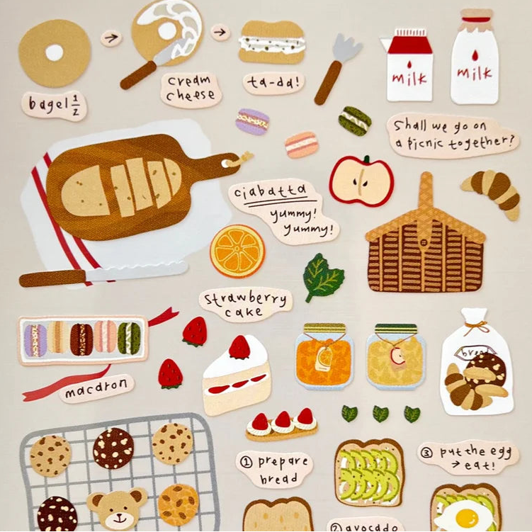 Celebrate the simple joy of fresh‑baked goodness with the I Like Bread sticker sheet from Suatelier. This sticker sheet is filled with adorable illustrations of loaves, pastries, and cozy bakery moments. Known for their soft colors and playful aesthetic, Suatelier stickers add an instant dose of warmth and whimsy wherever you place them.

Package measures approx. 8" x 3.5"
Includes 1 sticker sheet