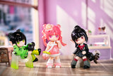 Suri's Colorful Girls Figure Dolls Blind Box Three colorful figurines with distinct hairstyles and outfits on a wooden floor.