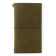TRAVELER'S Notebook Olive (Regular Size) A closed TRAVELER'S Notebook in olive color, showing the leather cover and the metal band fastener.