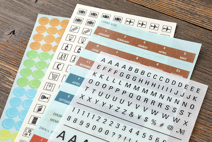 This is a sticker set for customizing your TRAVELER’S notebook that makes it more fun, including index and pocket stickers, icon stickers to represent different plans, dry transfer, and stickers to decorate the cover. The 2027 version features a design that is inspired by “Every TRAVELER’S notebook is unique and that’s wonderful.” You can customize your 2027 diary, and that’s wonderful.
