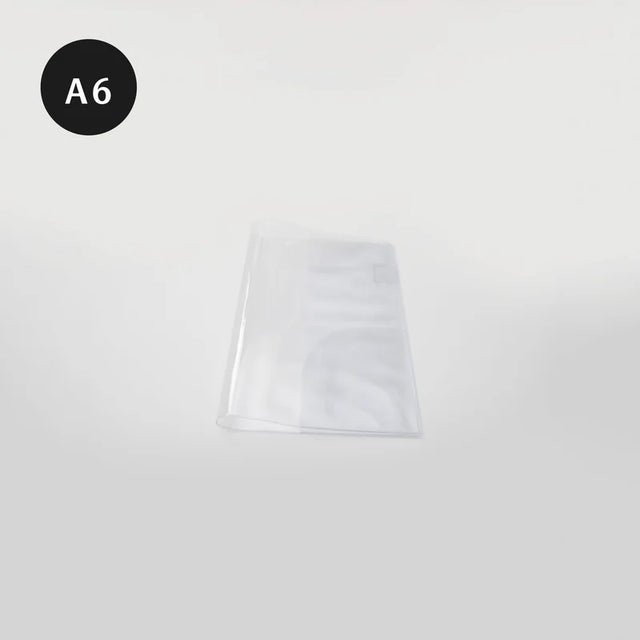 Take A Note Clear Cover A6
Size: 22.5 x 15.5 x 0.2cm
Material: PVC&nbsp;
Fit: Take A Note Mini Planner A6
The outer layer features transparent PVC, providing a clear and bright appearance.
The inside of the cover is matte surface, and small objects such as stickers and notes will not be attached by static electricity and are eays to take.
The interior includes a pen holder for convenient storage of commonly used pens.
This product does not contain the planner.

Order the Take A Note A6 Mini Planner here: Ta