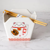 Everything tastes better in a to-go container…but this one is designed to be reusable

Bowl Size: 5" Dia x 4"H
Chopsticks 9"L
Capacity: 16 fl oz
Material: Ceramic
Microwave and Dishwasher Safe
Origin: China