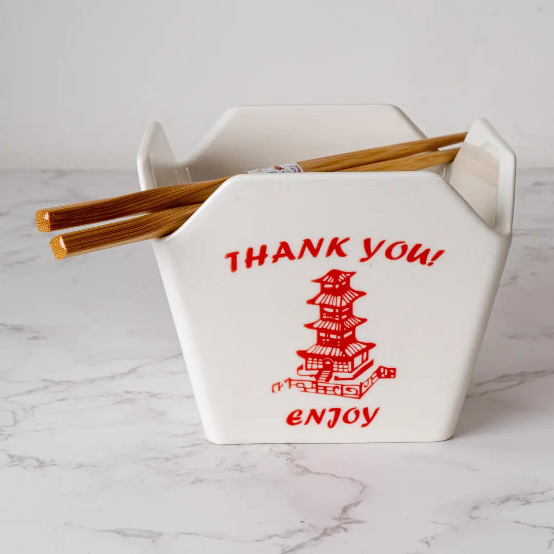 Everything tastes better in a to-go container…but this one is designed to be reusable

Bowl Size: 5" Dia x 4"H
Chopsticks 9"L
Capacity: 16 fl oz
Material: Ceramic
Microwave and Dishwasher Safe
Origin: China