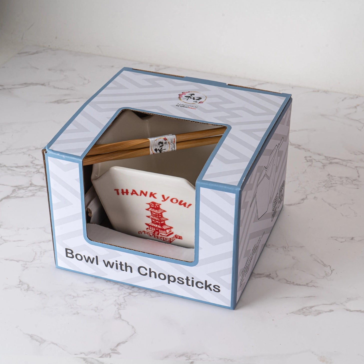 Everything tastes better in a to-go container…but this one is designed to be reusable

Bowl Size: 5" Dia x 4"H
Chopsticks 9"L
Capacity: 16 fl oz
Material: Ceramic
Microwave and Dishwasher Safe
Origin: China