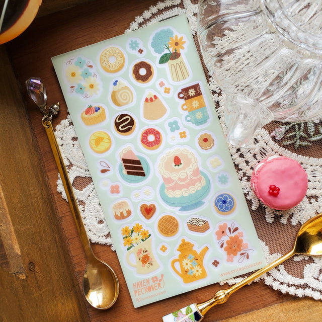 🫖🍩 A delish pastry really is the cherry on top of a lovely tea time and @havenpeckover offers us a divine variety that’s sure to take any tea time to the next level. These freshly baked goods are not just a feast for the stomach, but also a feast for the eyes! Art by: @havenpeckover

Top Coating: Textured
Adhesive Layer: PVC (plastic)
Backing Layer: Clear PET
6.69" x 3.54".
Weight - 0.03lbs
1 sheet included