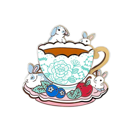 These pastel bunnies are spending a relaxing day amongst blueberries, cherries, and yummy tea inside an intricately decorated cup.

✦ Hard enamel
✦ Shiny gold metal
✦ 1.75 inches
✦ 2 Posts for extra security
✦ Rubber backings
✦ Back stamped for authenticity

Comes packaged on a backing card.