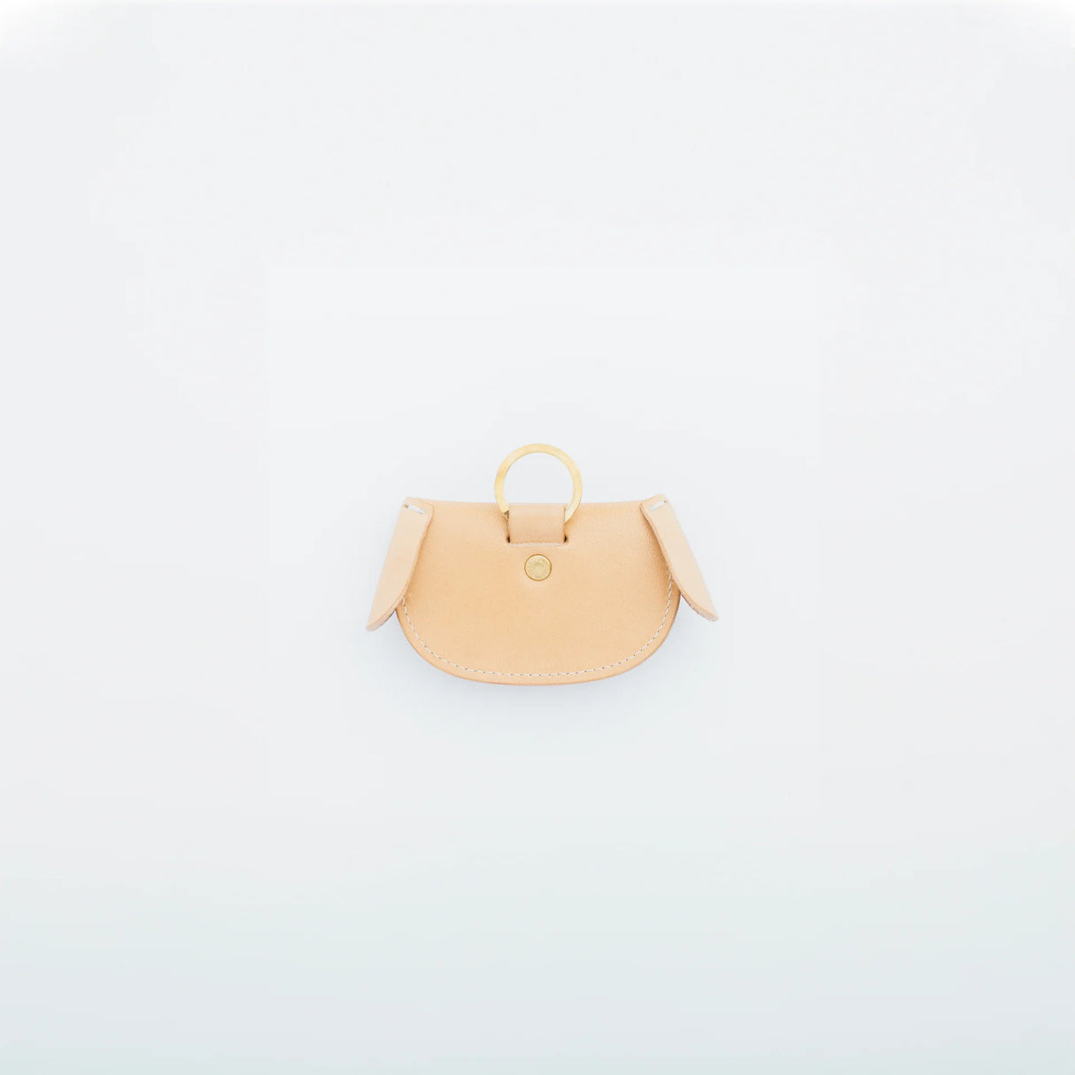 A coin purse with a dog motif.

It is small enough to carry in your pocket when you are out and about. Compact and sturdy, it can be used for many years, and the design is cute and makes a nice accent.