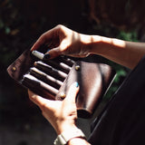 This case for fountain pens can hold five pens individually.

Lined with pig suede for a luxurious look and feel, your precious pens will be well protected and carried.

The buttons are original, made of solid brass and stamped with T.S.L.

SIZE :&nbsp;L13cm × H15cm


COLOR : Camel / Brown&nbsp;/ Black


MATERIAL :&nbsp;Cow leather

Leather Products:

The leather used in this product is natural leather.
We do not use scratches that lead to tears or rips, but we use scratches and wrinkles that are originally