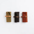 The SUPERIOR LABOR Glove Leather - Roll Pen Case

The discontinued&nbsp;pen roll&nbsp;has returned with a refined new design.&nbsp;A brass tag accents its raw-cut edge, while the logo inside is finished with elegant gold foil.&nbsp;The result is a fresh look that feels both light and sophisticated.

Pockets in varying sizes hold pens of different types, and when you’re done, simply roll it up and take it with you.

A pen case that combines the joy of displaying your favorite pens with the practicality of ca